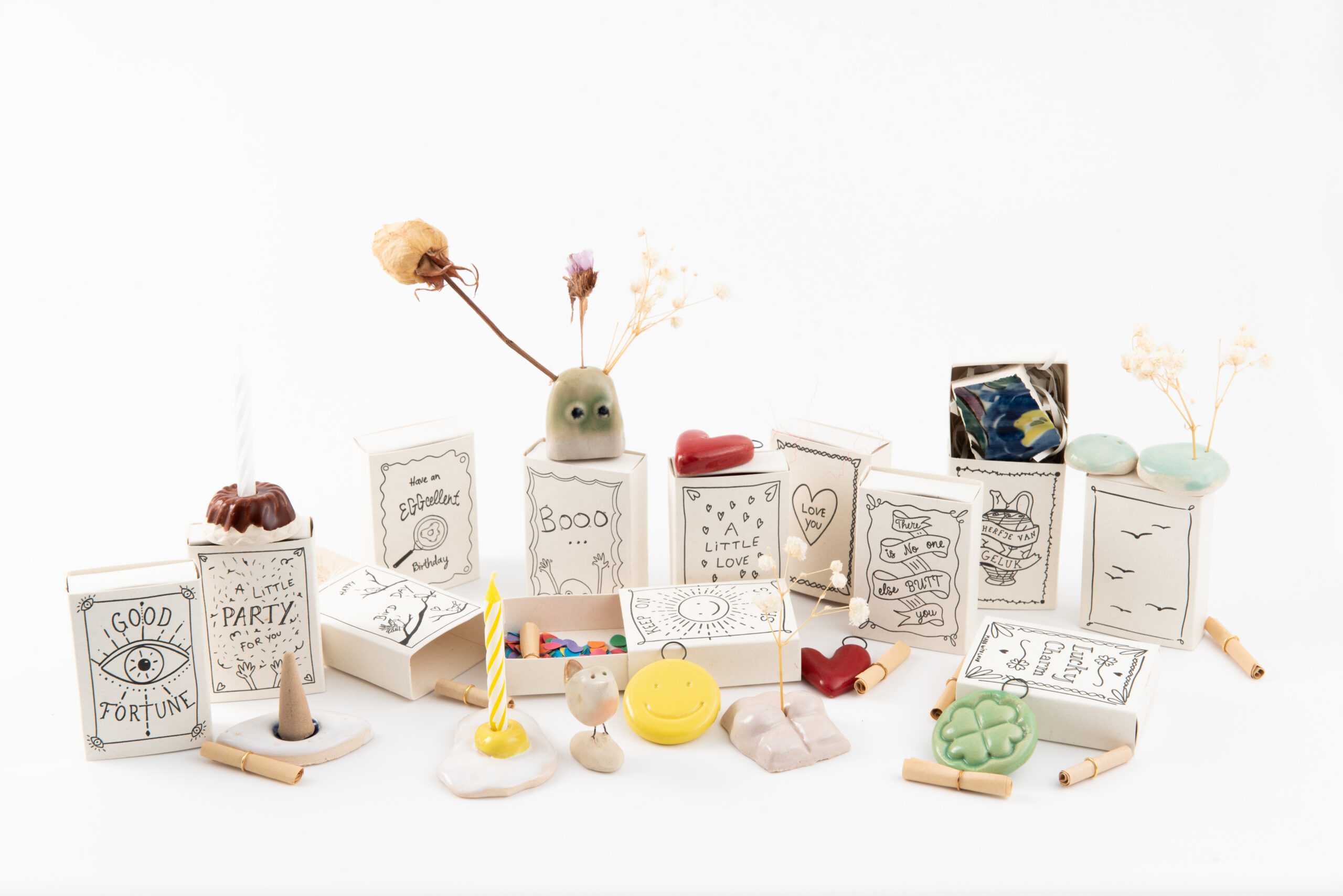 A collection of Studio Gentle matchboxes with small messages